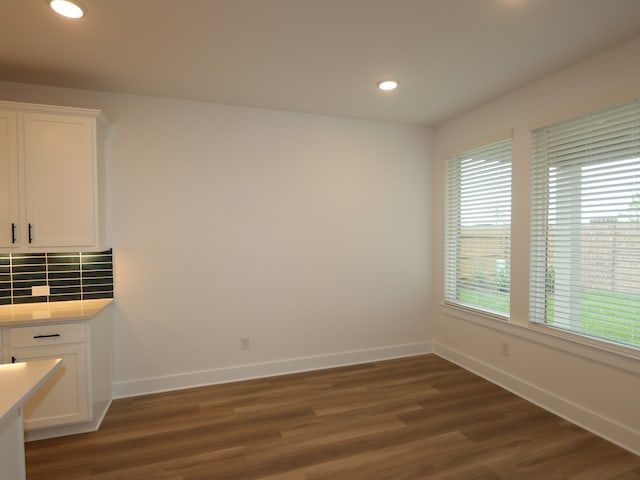 21706 Persian Lake Dr, Cypress, TX 77433 - unfurnished dining area with dark wood-type flooring and recessed lighting