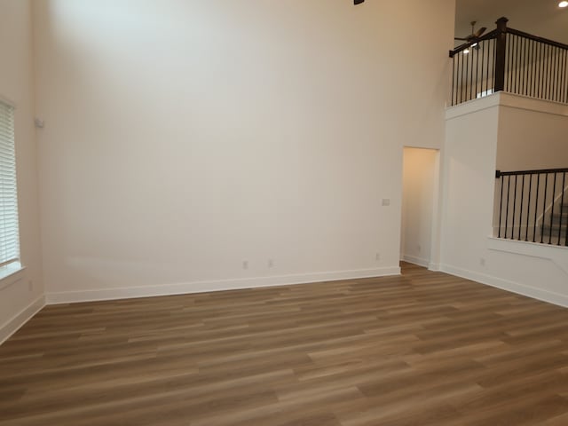 21706 Persian Lake Dr, Cypress, TX 77433 - spare room with wood finished floors and a towering ceiling