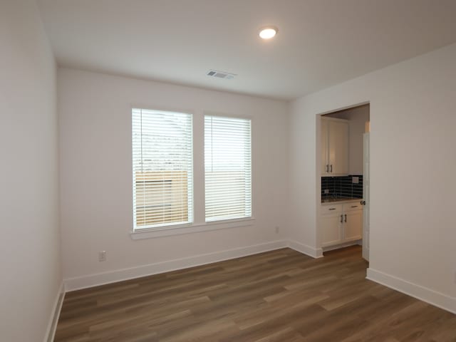 21706 Persian Lake Dr, Cypress, TX 77433 - unfurnished room with dark wood-type flooring and baseboards