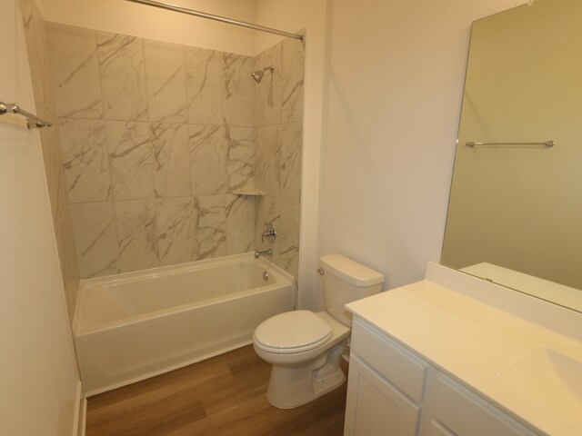 21706 Persian Lake Dr, Cypress, TX 77433 - bathroom with wood finished floors, washtub / shower combination, and vanity