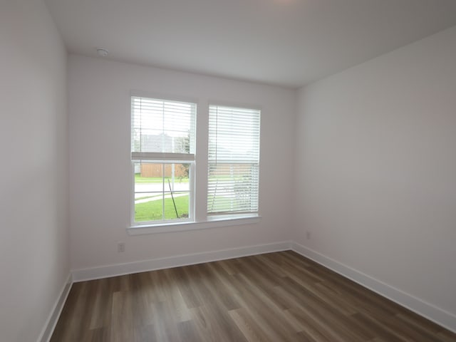 21706 Persian Lake Dr, Cypress, TX 77433 - unfurnished room with plenty of natural light and dark wood-style floors
