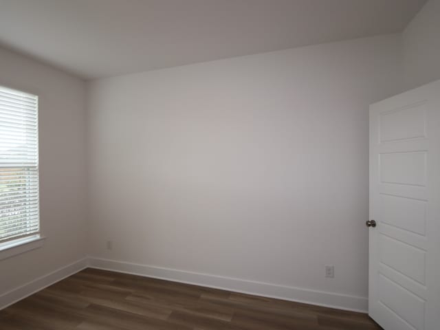 21706 Persian Lake Dr, Cypress, TX 77433 - spare room featuring dark wood-type flooring and baseboards