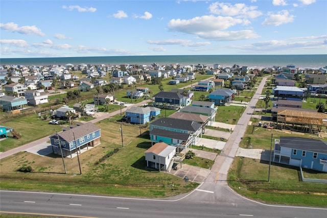 drone / aerial view featuring a water view and a residential view