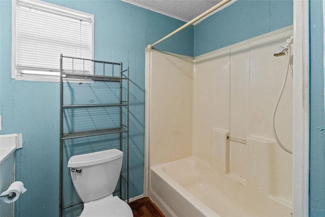 bathroom featuring toilet and a textured ceiling