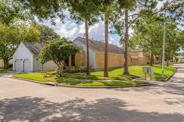 view of home's exterior with a garage and a yard