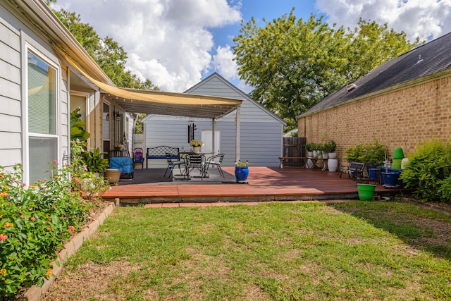 deck with a lawn and fence