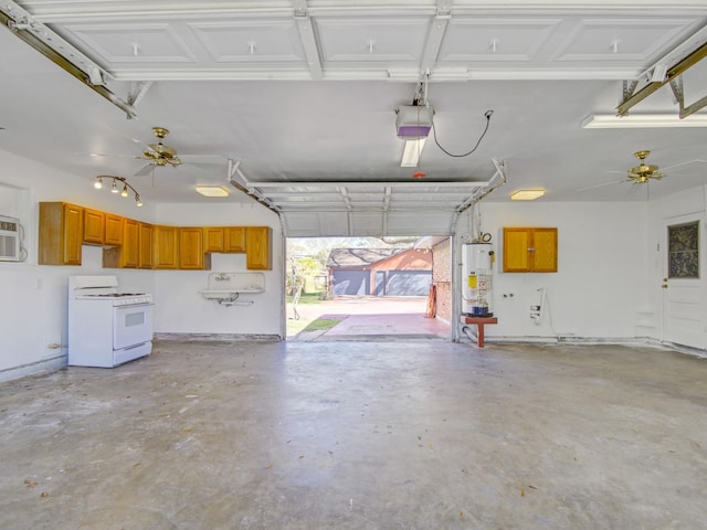 garage featuring water heater and a garage door opener