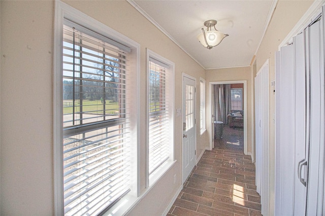 hallway featuring ornamental molding