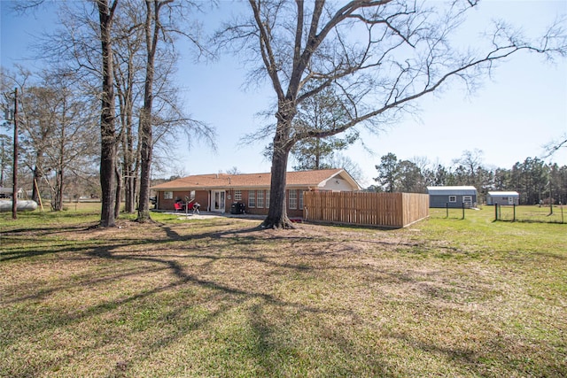 view of yard featuring a patio area and fence