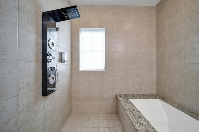 bathroom featuring tiled shower