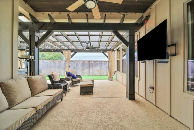 view of patio / terrace with outdoor lounge area, a ceiling fan, and fence