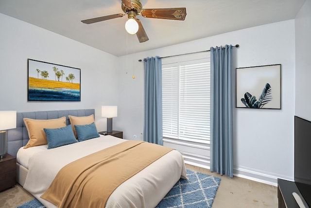 bedroom with baseboards, multiple windows, a ceiling fan, and light colored carpet