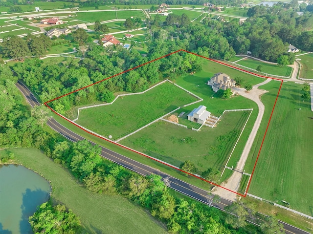 drone / aerial view with a water view and a rural view