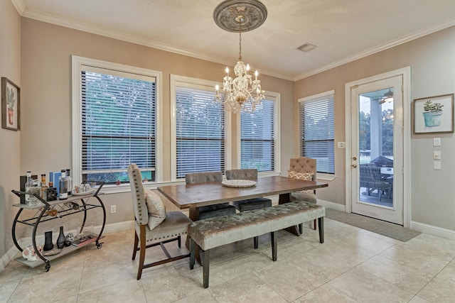 dining area featuring crown molding, visible vents, and a healthy amount of sunlight