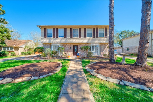 colonial inspired home with brick siding