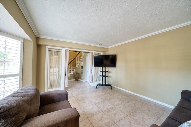 living room featuring a textured ceiling, light tile patterned floors, baseboards, stairs, and ornamental molding