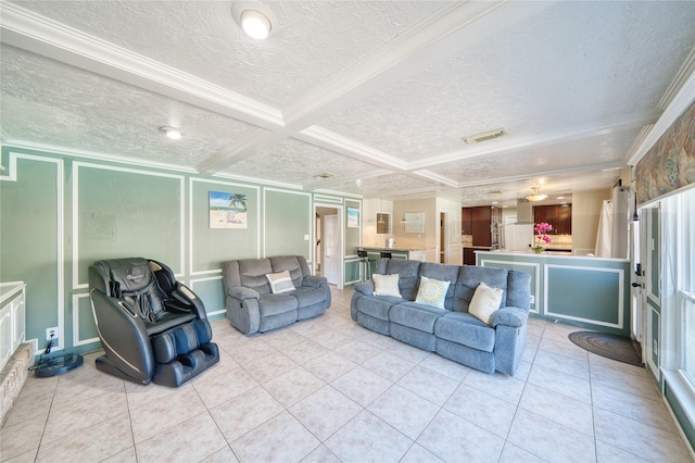 living room with visible vents, ornamental molding, a textured ceiling, a decorative wall, and light tile patterned flooring