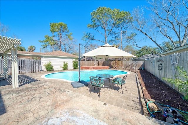 view of swimming pool with a patio, a fenced backyard, a fenced in pool, and a pergola