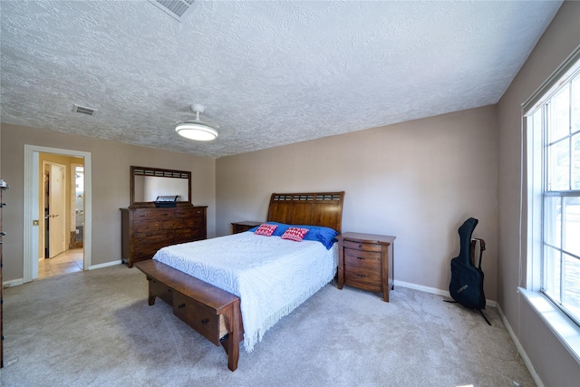 bedroom with carpet flooring, visible vents, and baseboards