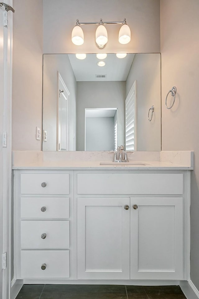 bathroom featuring visible vents and vanity