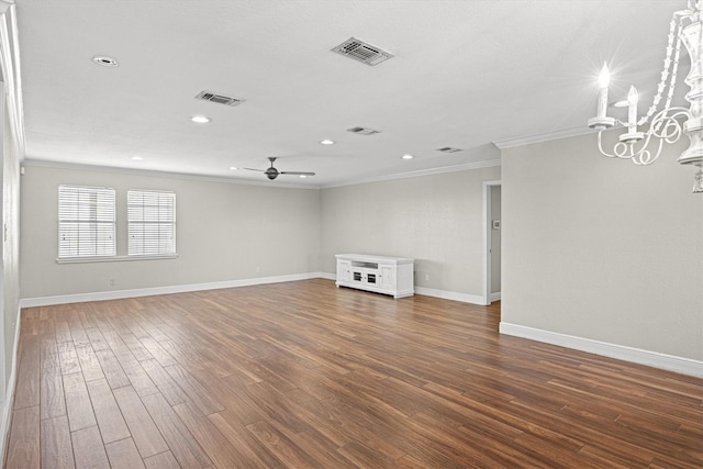 unfurnished room featuring visible vents, ornamental molding, wood finished floors, baseboards, and ceiling fan with notable chandelier