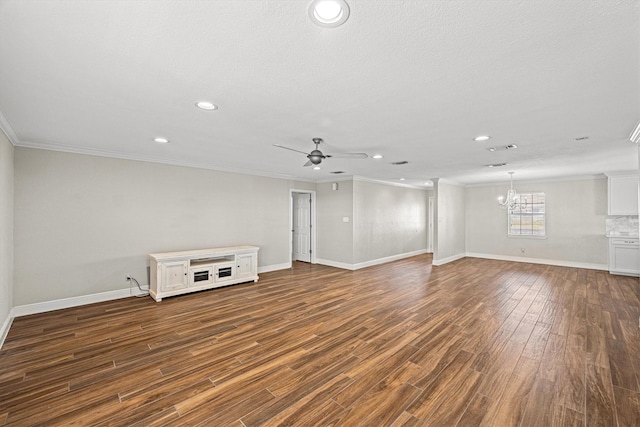 empty room featuring recessed lighting, ceiling fan with notable chandelier, dark wood-style flooring, baseboards, and crown molding