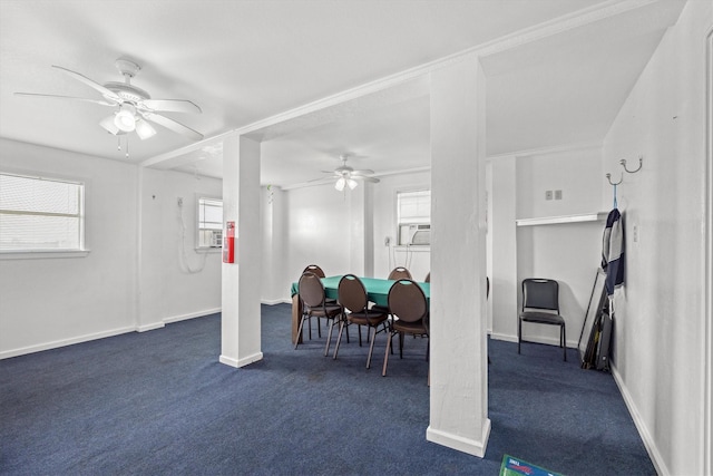 dining space featuring dark colored carpet, ceiling fan, and baseboards