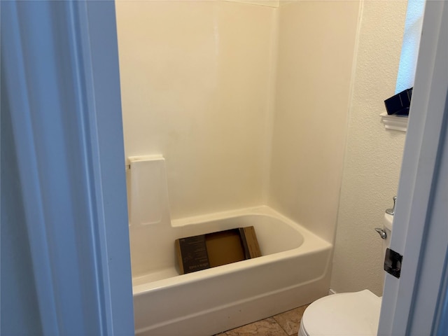 bathroom featuring a washtub, toilet, and walk in shower