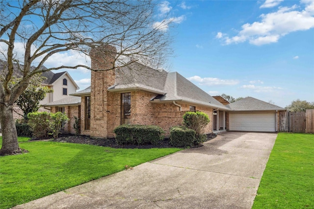 view of front of house with fence, concrete driveway, an attached garage, a front yard, and brick siding