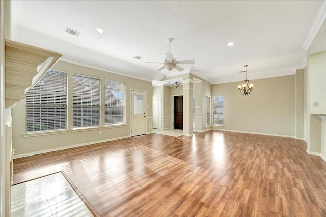 unfurnished living room featuring light wood finished floors, visible vents, ornamental molding, baseboards, and ceiling fan with notable chandelier