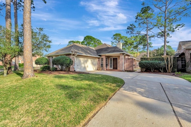 ranch-style house featuring brick siding, a chimney, concrete driveway, an attached garage, and a front yard