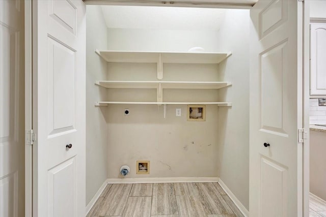 clothes washing area with laundry area, gas dryer hookup, hookup for an electric dryer, light wood-type flooring, and washer hookup