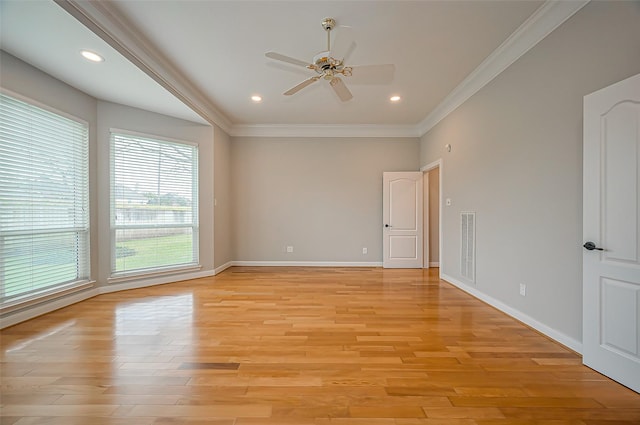 spare room with baseboards, a ceiling fan, crown molding, light wood-style floors, and recessed lighting