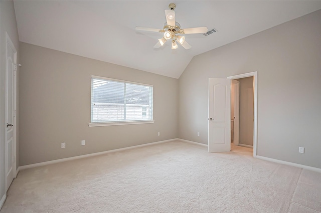 unfurnished bedroom featuring lofted ceiling, baseboards, visible vents, and light colored carpet