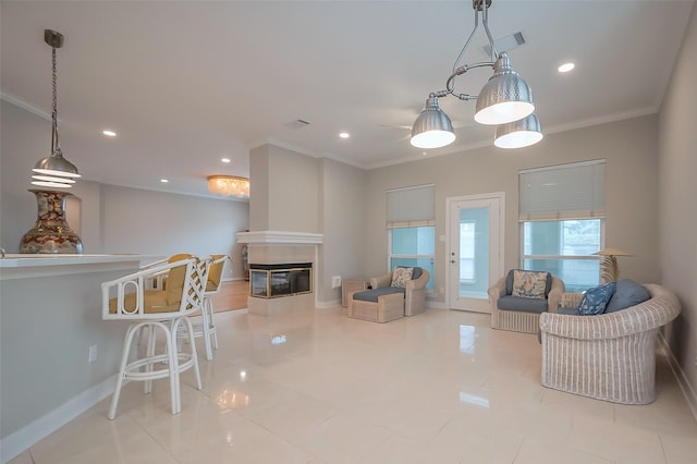 living area featuring crown molding, recessed lighting, visible vents, a tile fireplace, and baseboards