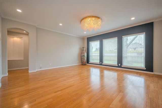 empty room with recessed lighting, light wood-style flooring, and baseboards