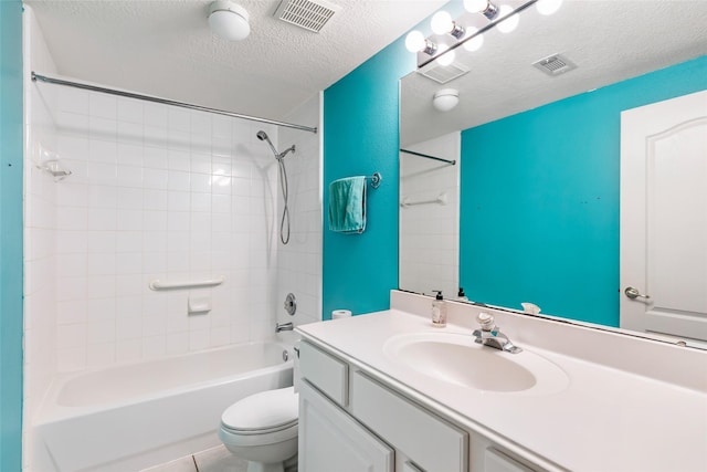 full bathroom featuring visible vents, a textured ceiling, toilet, and vanity