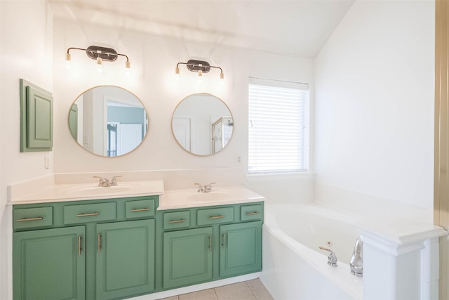 full bathroom with double vanity, tile patterned flooring, a tub with jets, and a sink