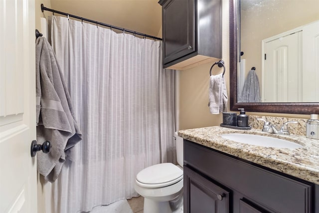 full bath with toilet, curtained shower, vanity, and tile patterned floors