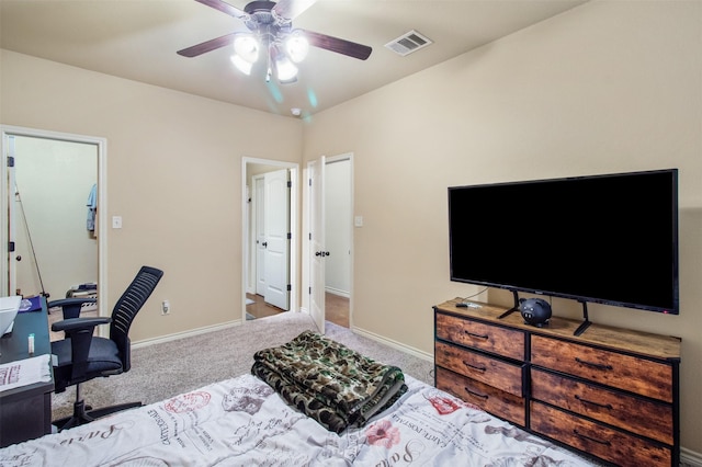 carpeted bedroom with baseboards, visible vents, and ceiling fan