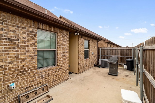 view of patio / terrace with a fenced backyard and central AC