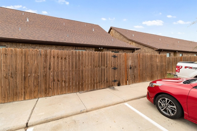 exterior space featuring fence and a gate