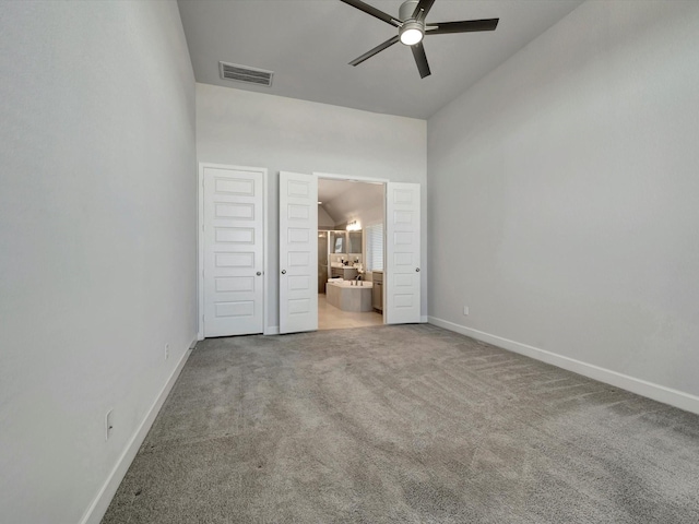 unfurnished bedroom featuring baseboards, visible vents, carpet floors, ceiling fan, and ensuite bathroom