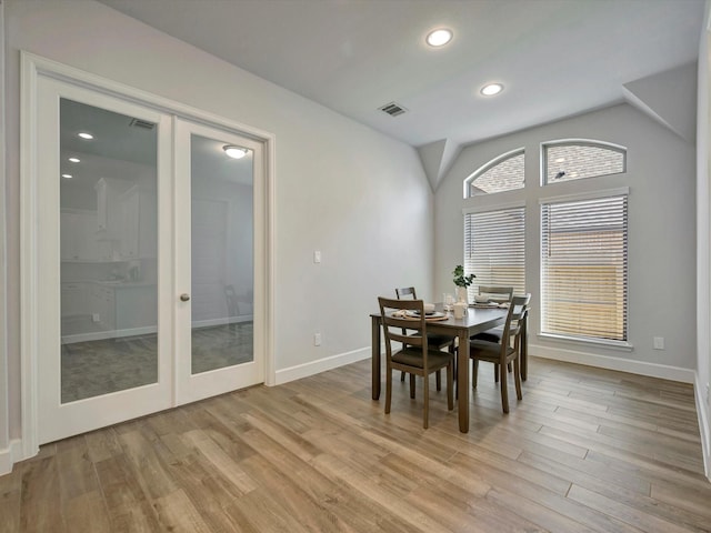 dining area featuring visible vents, baseboards, recessed lighting, french doors, and light wood-type flooring