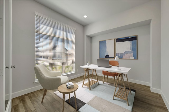 office space featuring recessed lighting, wood finished floors, and baseboards