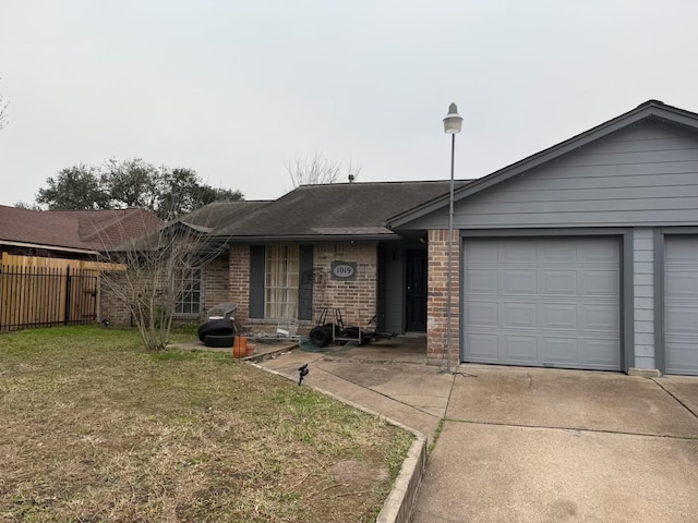 ranch-style house featuring an attached garage, brick siding, fence, driveway, and a front yard