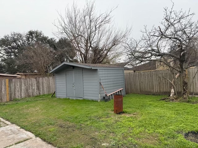 view of shed with a fenced backyard