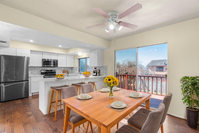 dining room with visible vents, a ceiling fan, dark wood-type flooring, and recessed lighting