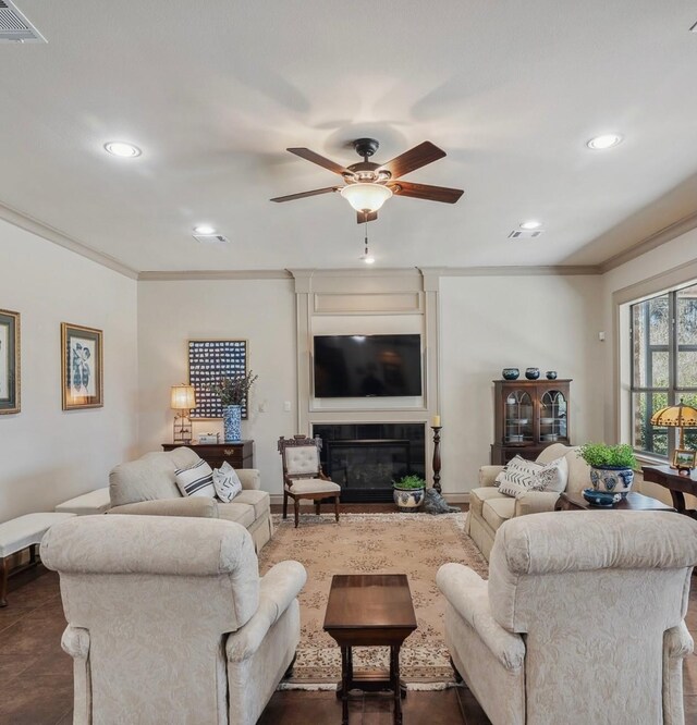 901 Longmire Rd Unit 17, Conroe, TX 77304 - living room featuring crown molding, ceiling fan, a large fireplace, and recessed lighting