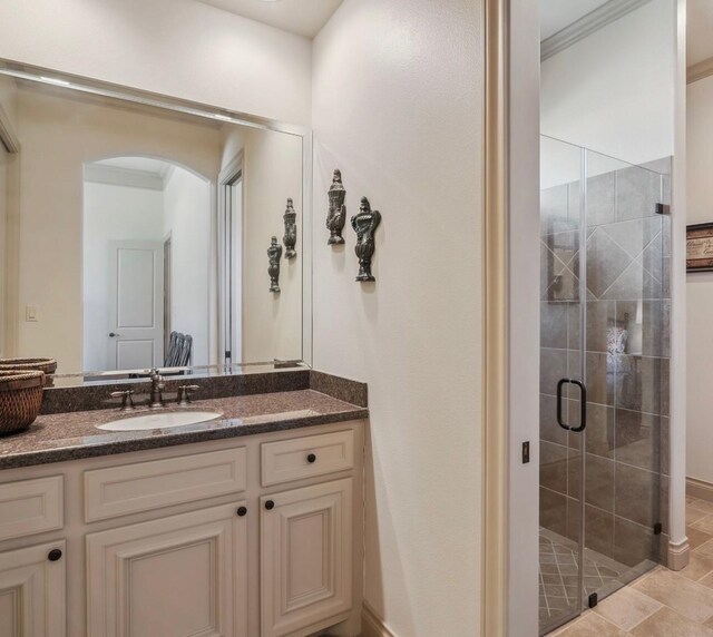 901 Longmire Rd Unit 17, Conroe, TX 77304 - full bath with vanity, a stall shower, and ornamental molding